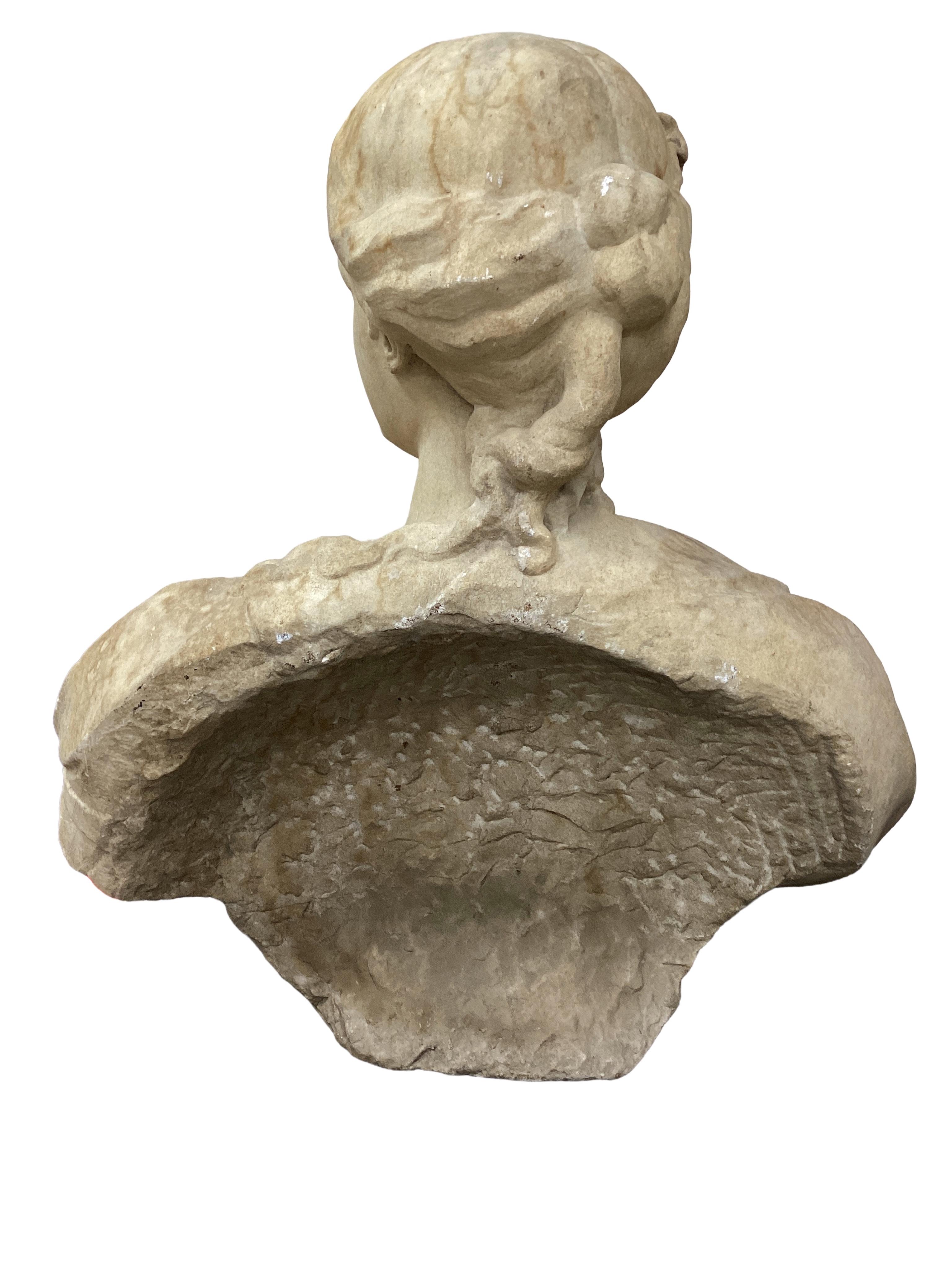 An oversized white marble bust of a classical maiden, 19th century